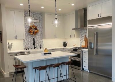 Modern country farmhouse kitchen after remodeling showcasing an island.