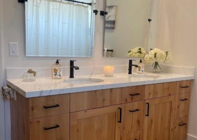 Modern country farmhouse new bathroom counter and cabinets.