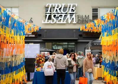 Guests lining up under the True West Film Center marquee