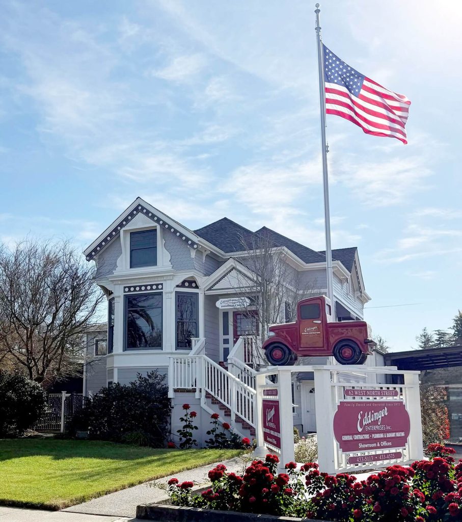 Eddinger head office in Healdsburg showcasing beautiful roses and the waving American flag.